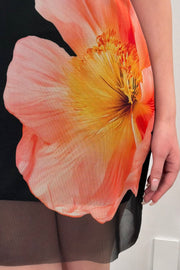 close-up of a mesh dress on top that has a floral design