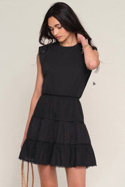 Woman wearing a black eyelet dress