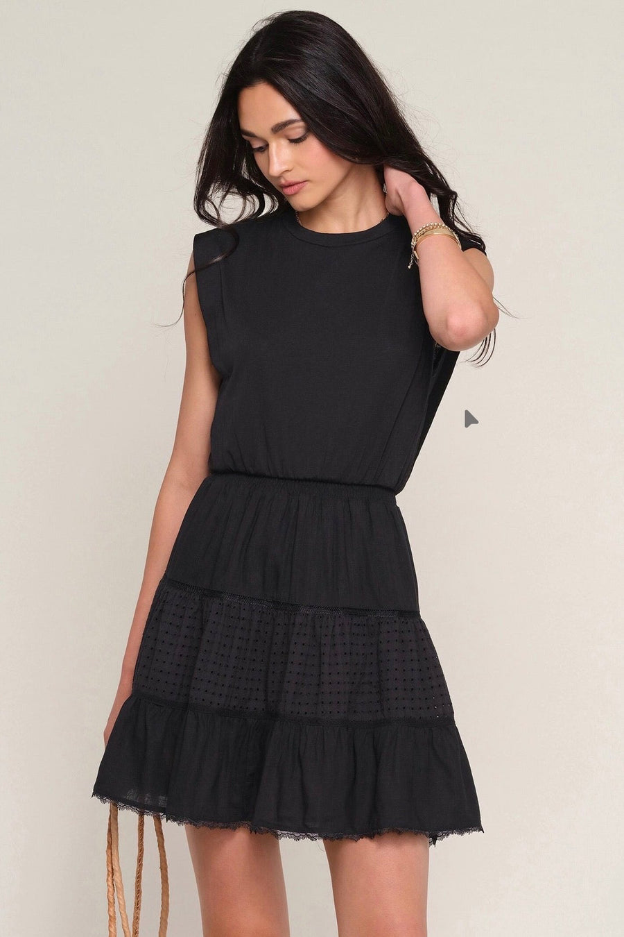 Woman wearing a black eyelet dress