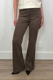 Front view of woman wearing a houndstooth knit pant