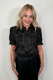 woman wearing black burnout short sleeve shirt