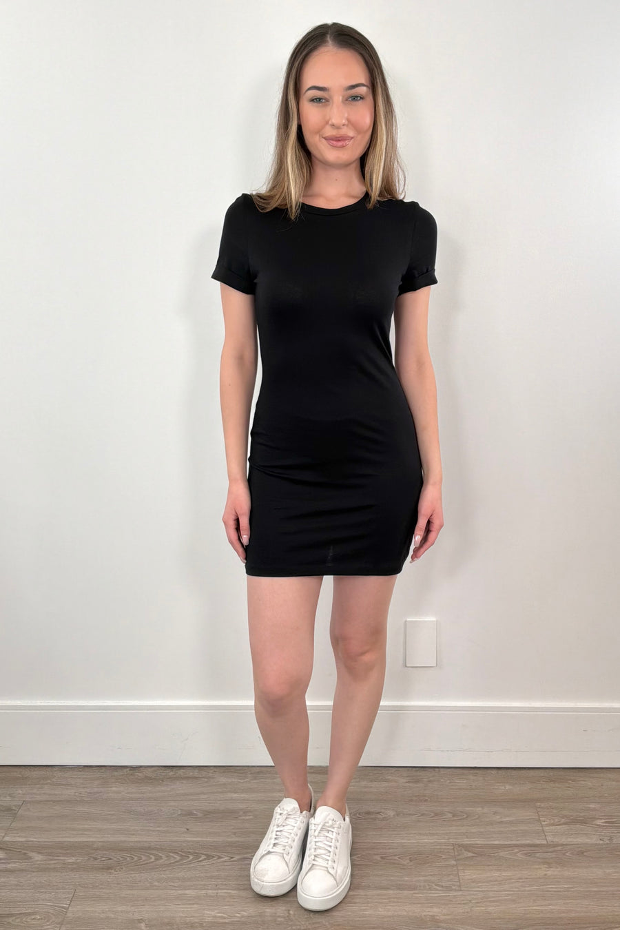 woman wearing a t-shirt black short dress