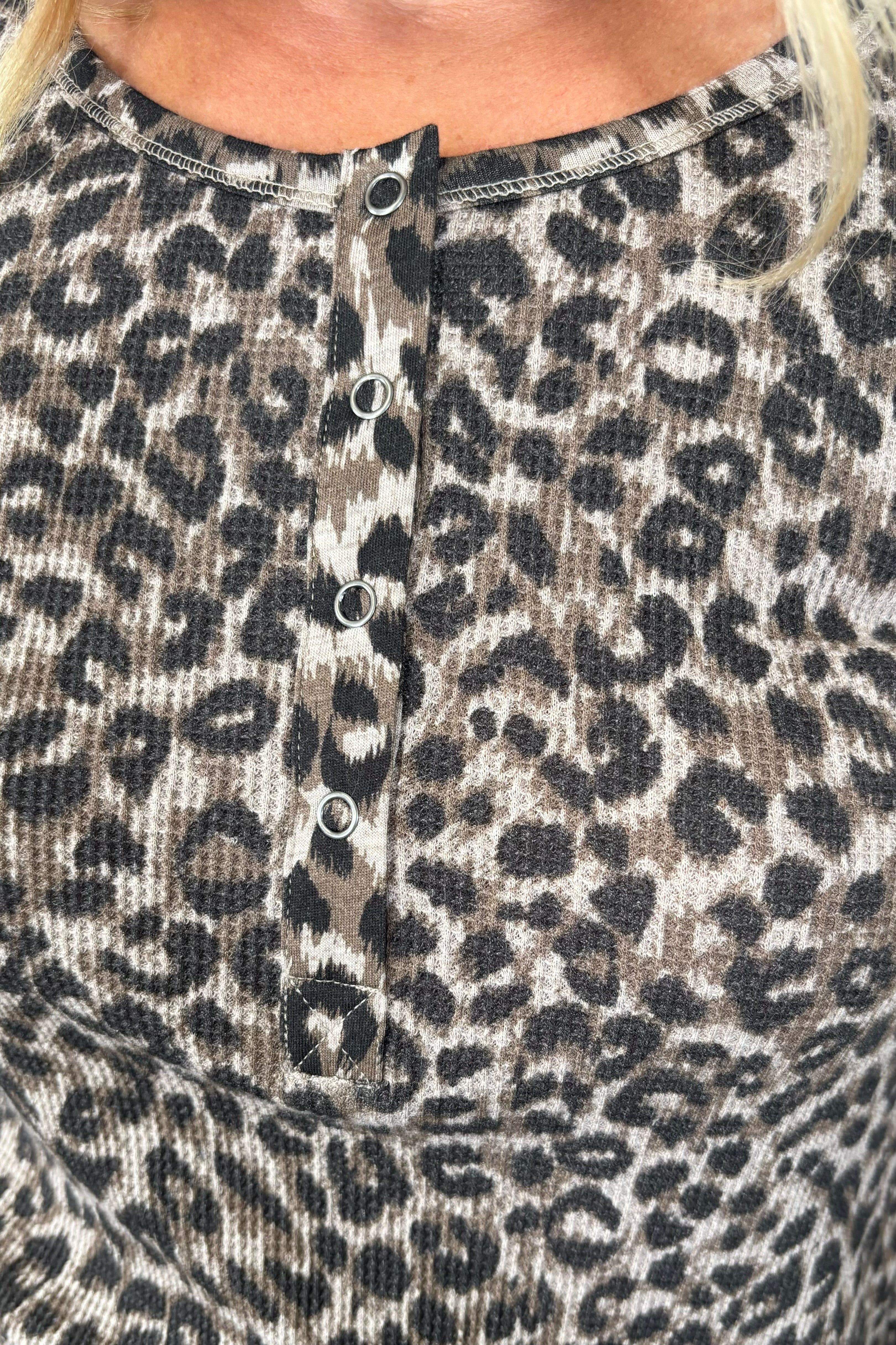 Close-up of a leopard print henley