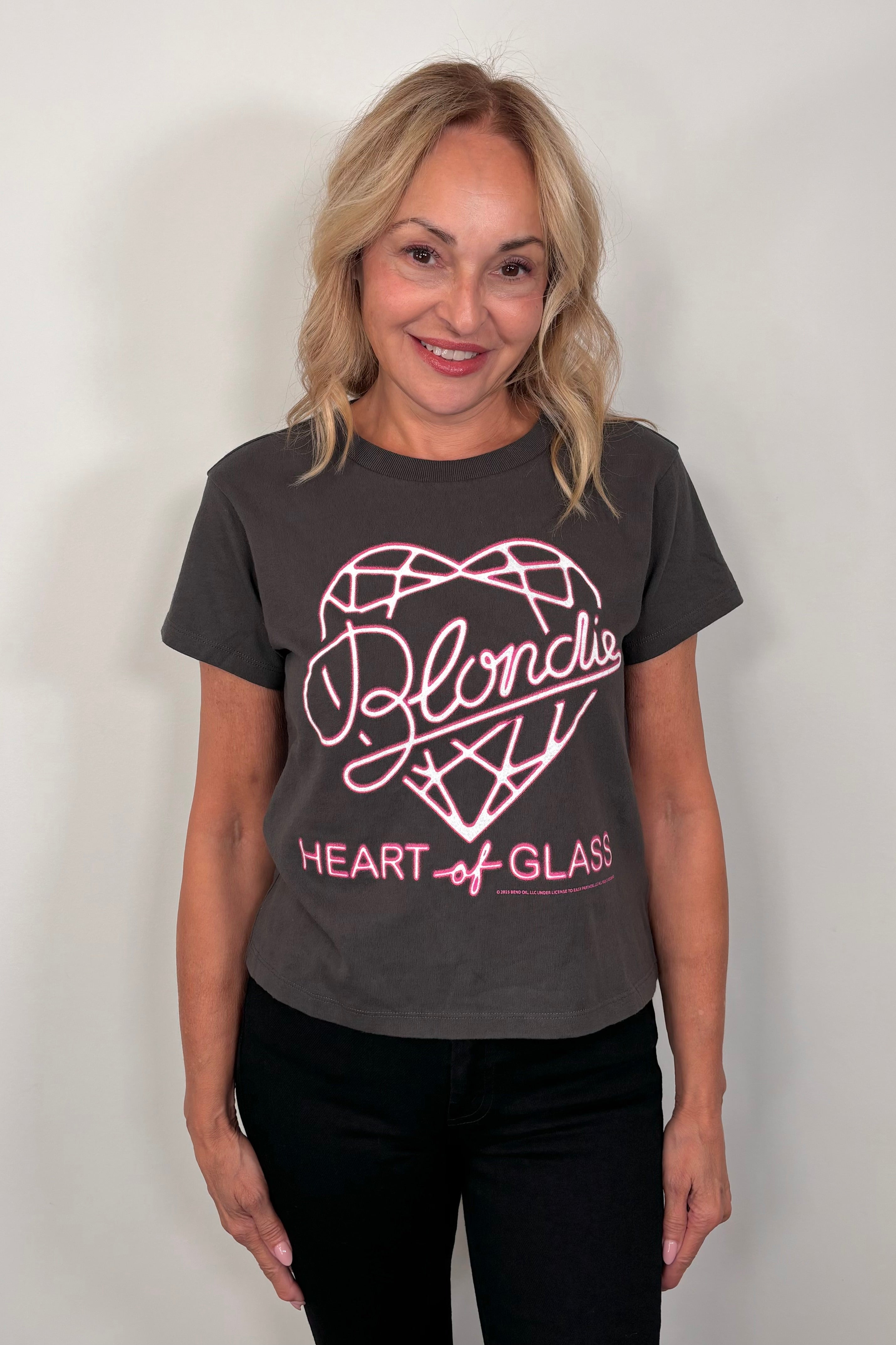 woman wearing a black t-shirt with pink graphic design