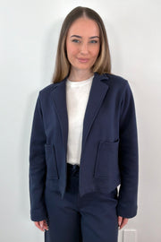woman wearing a navy blue 100% cotton blazer 