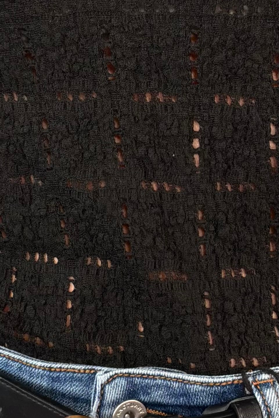 close-up of a black patterned long sleeve tee