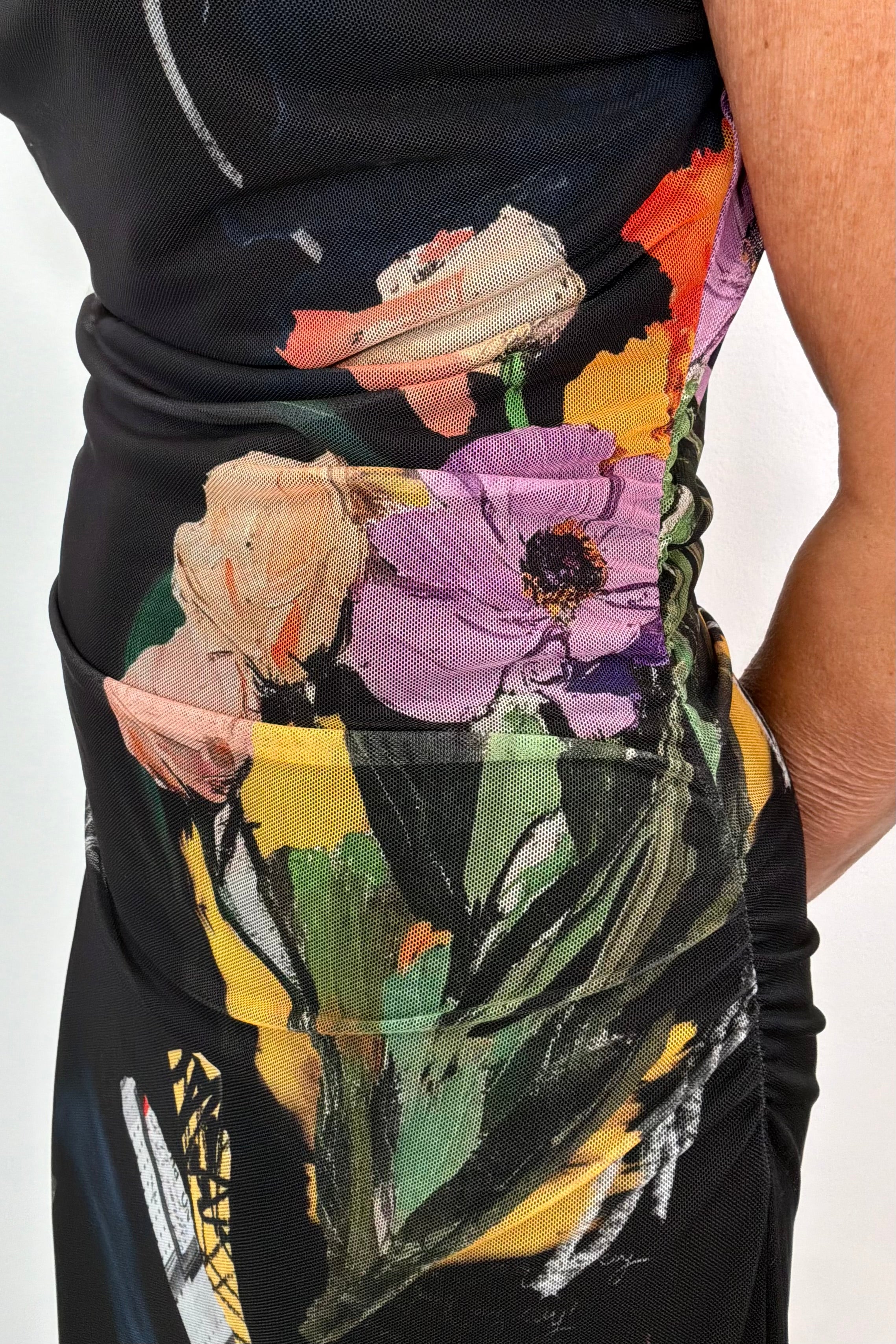 close-up of a black maxi lined flower pattern mesh dress with detail in the strap