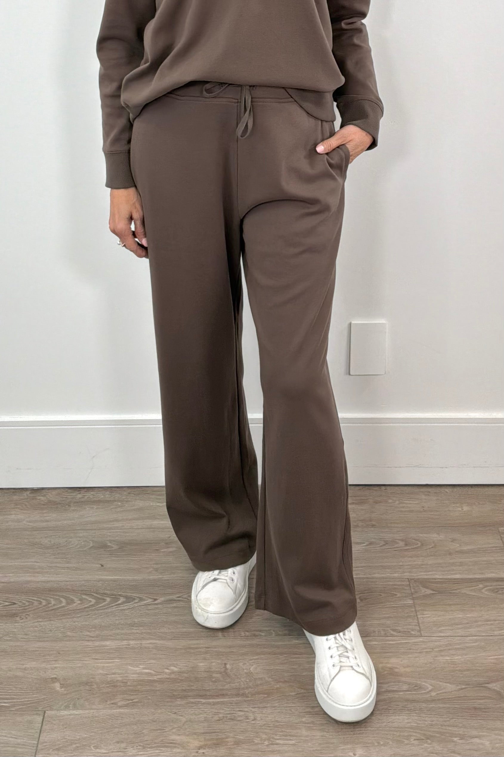 woman wearing a Pima cotton chestnut brown drawstring jogger
