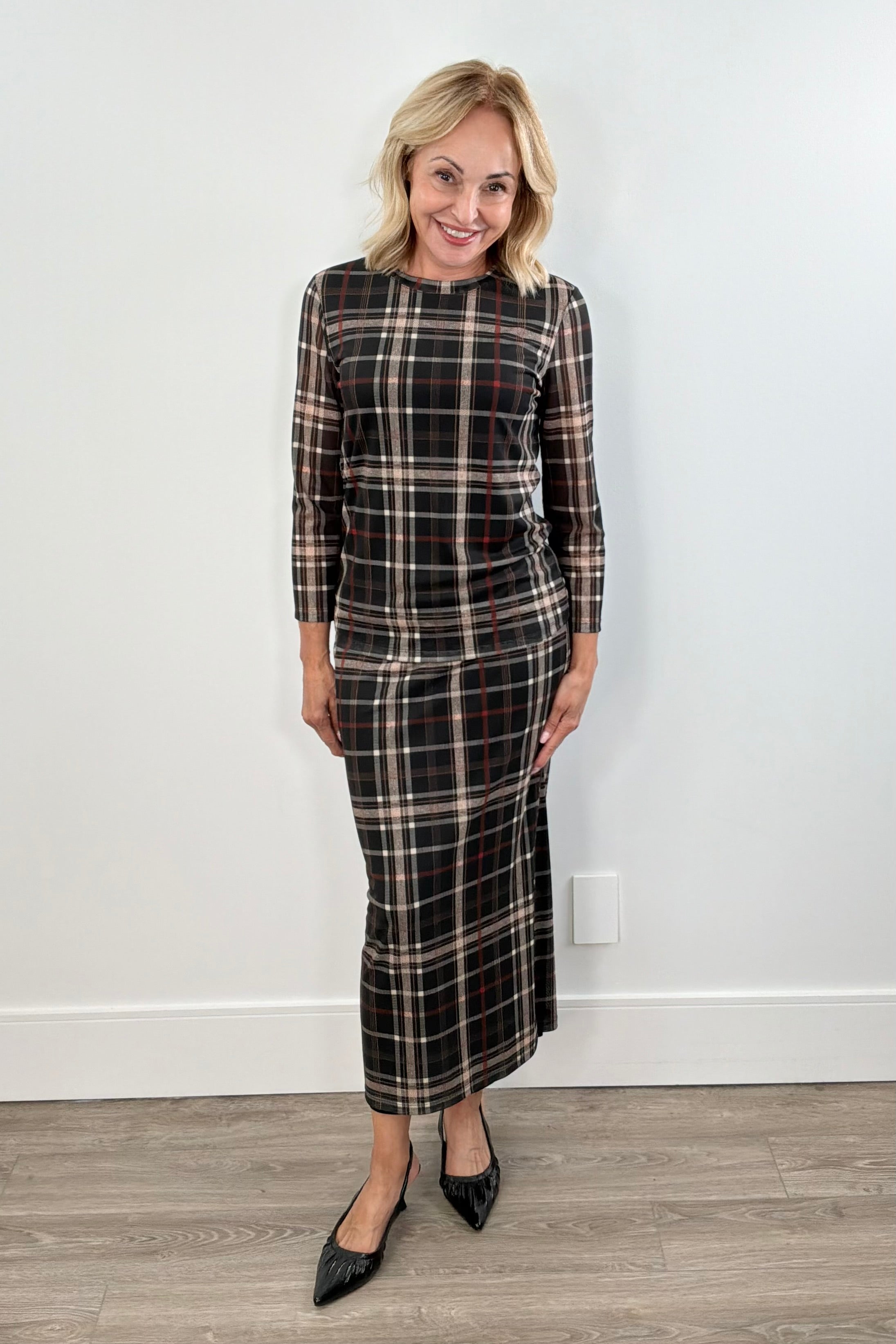 Woman wearing a plaid mesh top