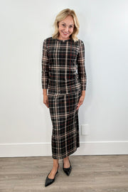 Woman wearing a plaid mesh top