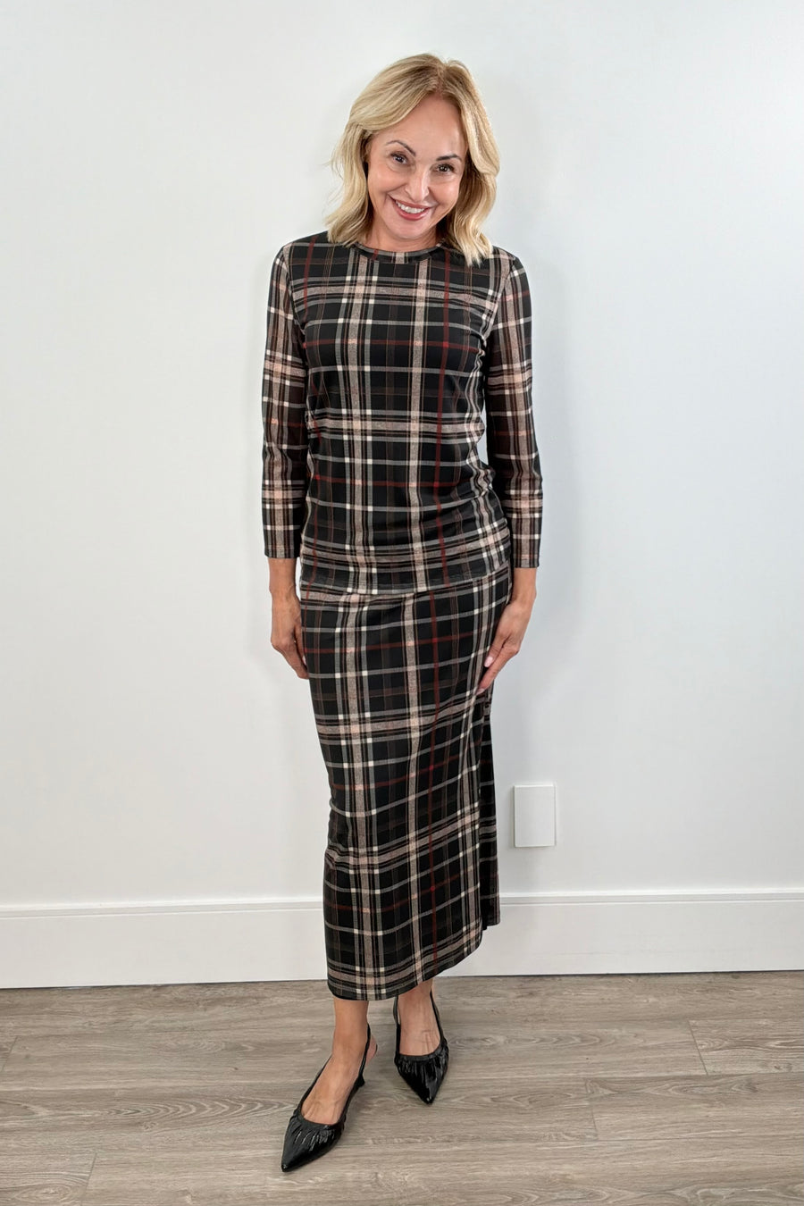 Woman wearing a plaid mesh top
