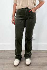 Woman wearing dark green pants