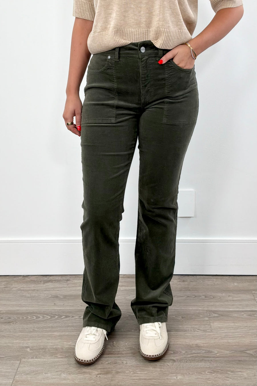 Woman wearing dark green pants