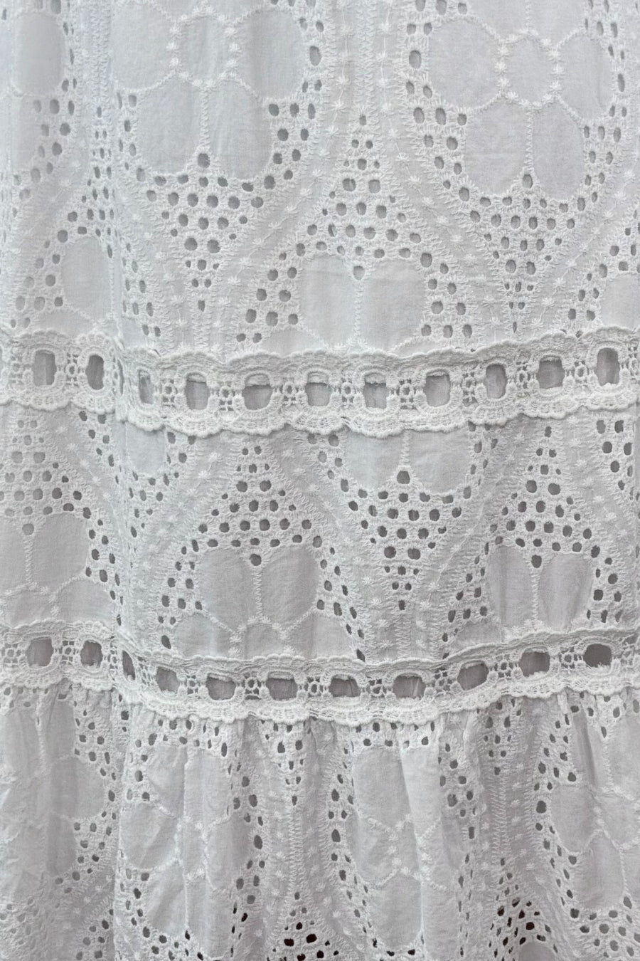  Close up of Woman wearing knit white dress
