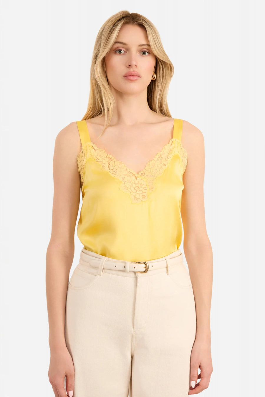 Woman wearing a yellow lace-trimmed Cami top