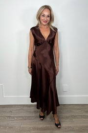 Front view of woman wearing a chocolate brown satin dress