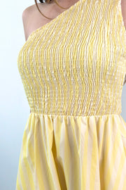 close-up of a one-shoulder elastic torso yellow and white stripped dress