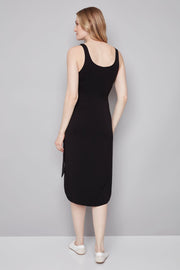 woman wearing a black midi dress with bow detailing n the side