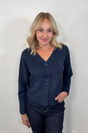 woman wearing a blue pocketless cardigan