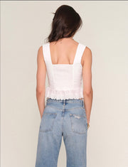 Back view of Woman wearing a white corset top