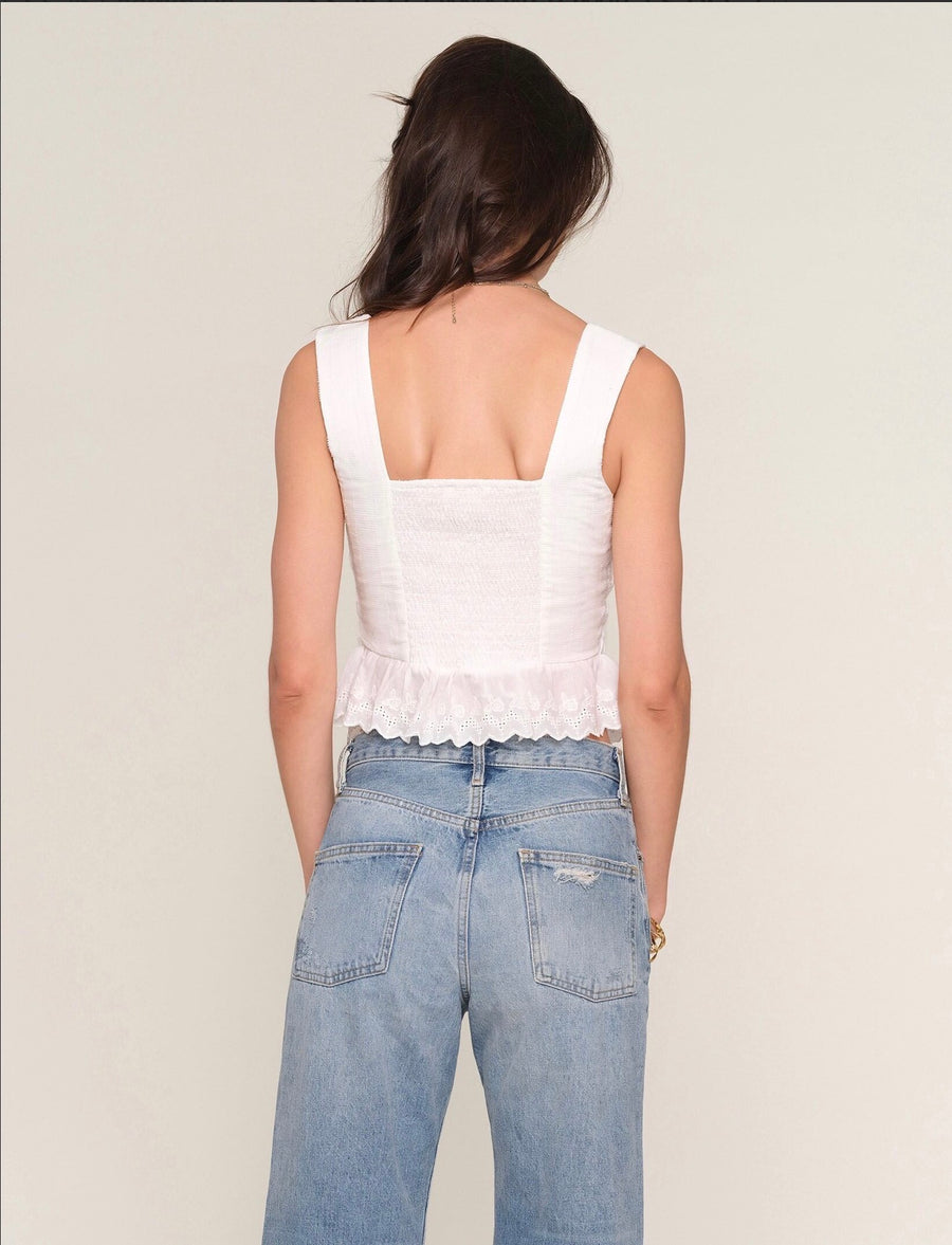 Back view of Woman wearing a white corset top
