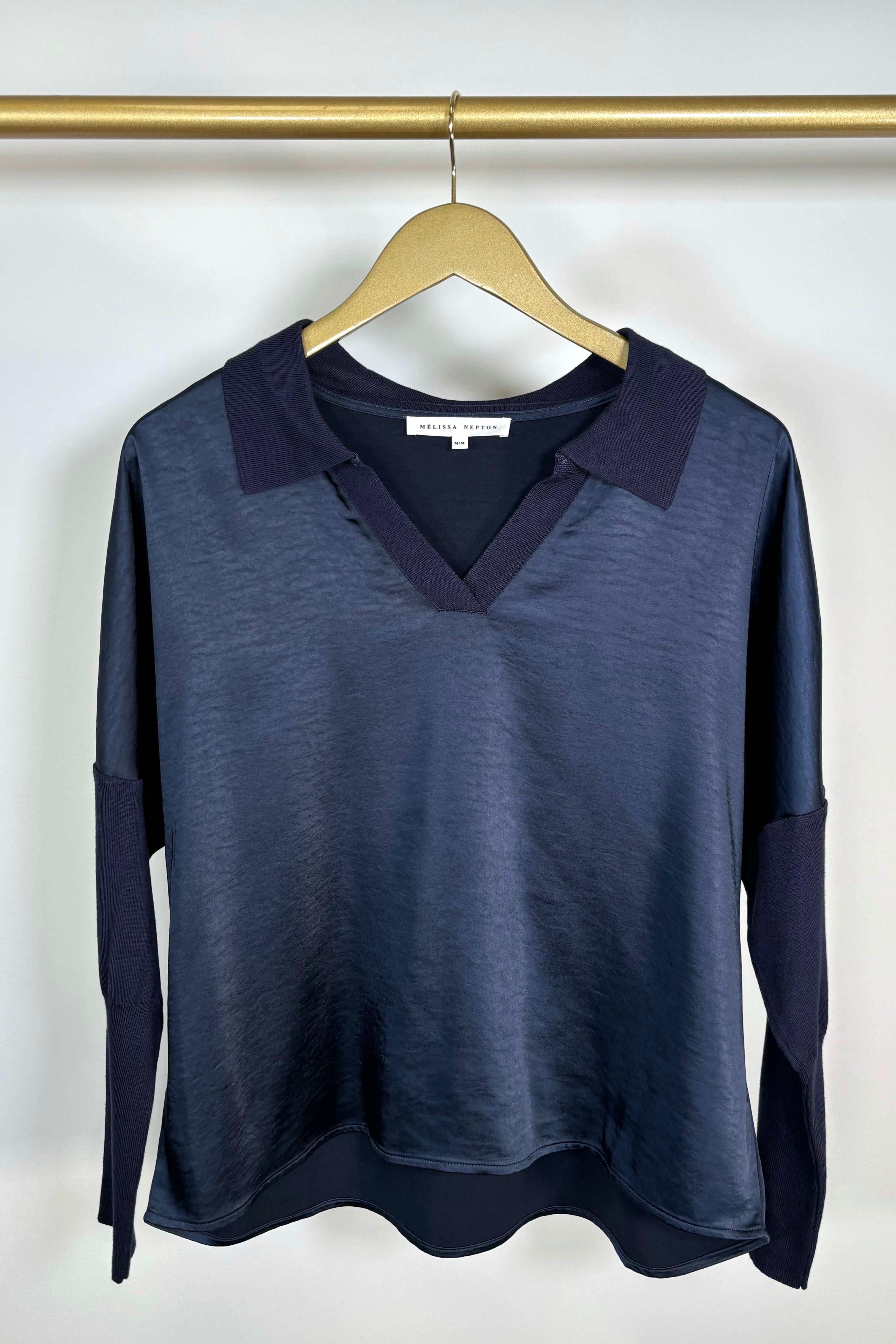 Front view of a deep navy long sleeve v-neck top 