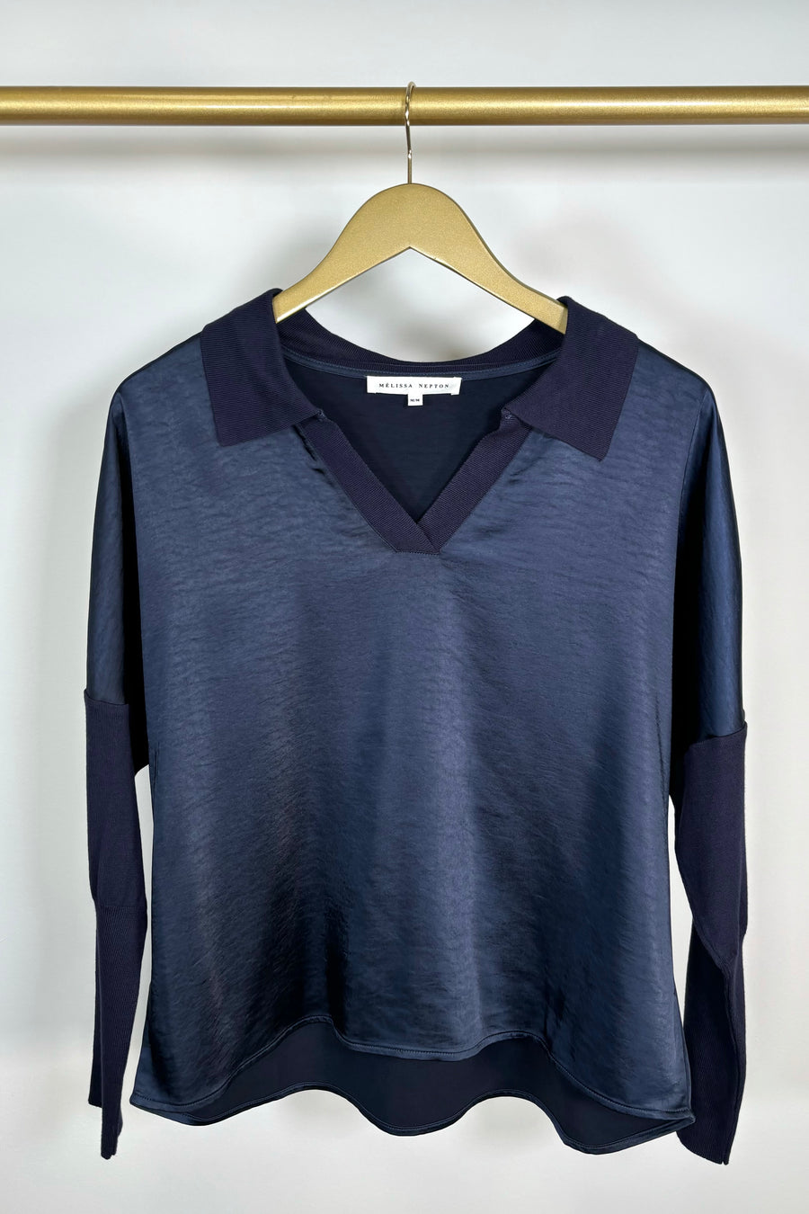 Front view of a deep navy long sleeve v-neck top 