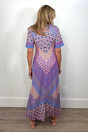 back view of woman wearing a patterned jersey midi dress