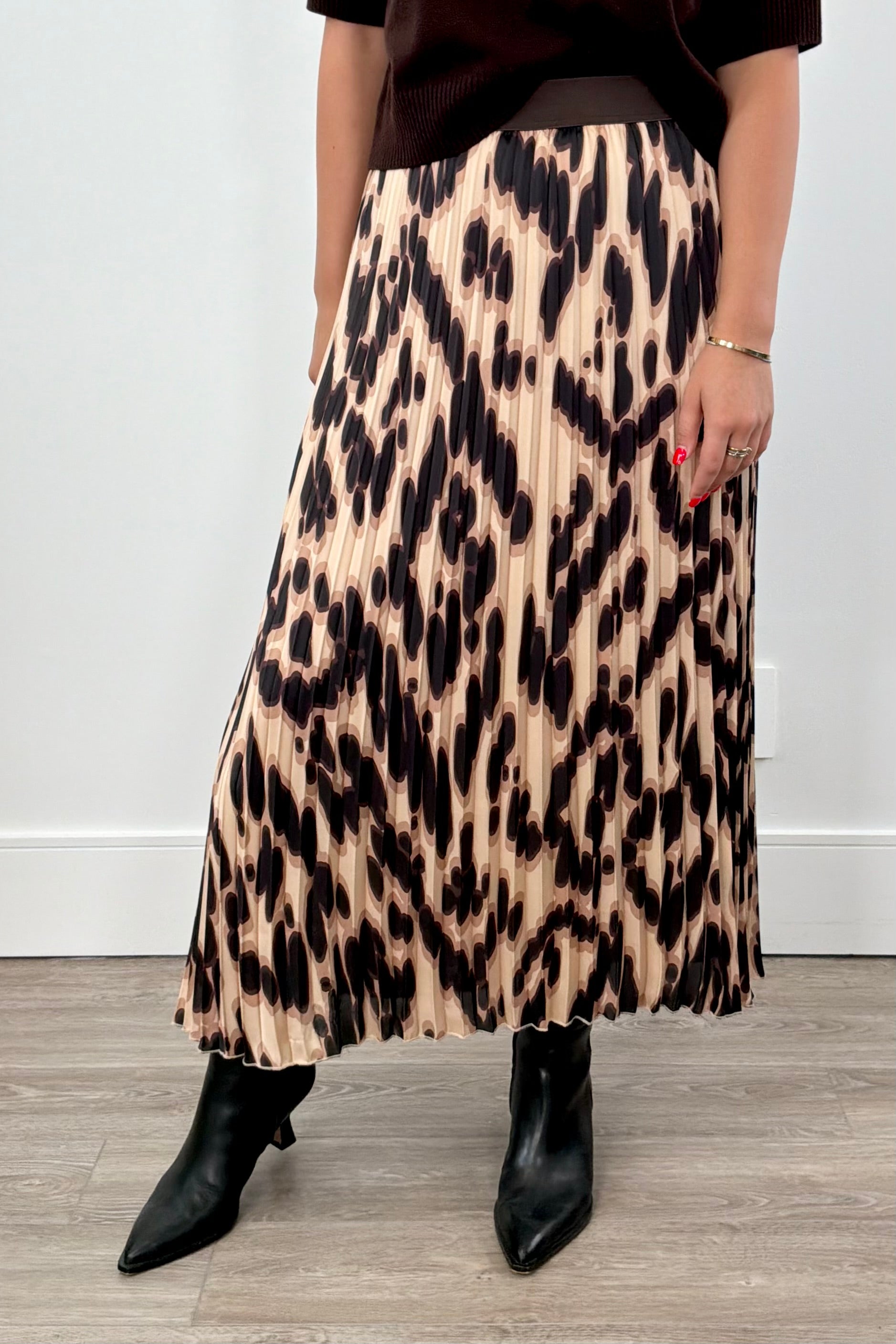 Person wearing a leopard print maxi skirt