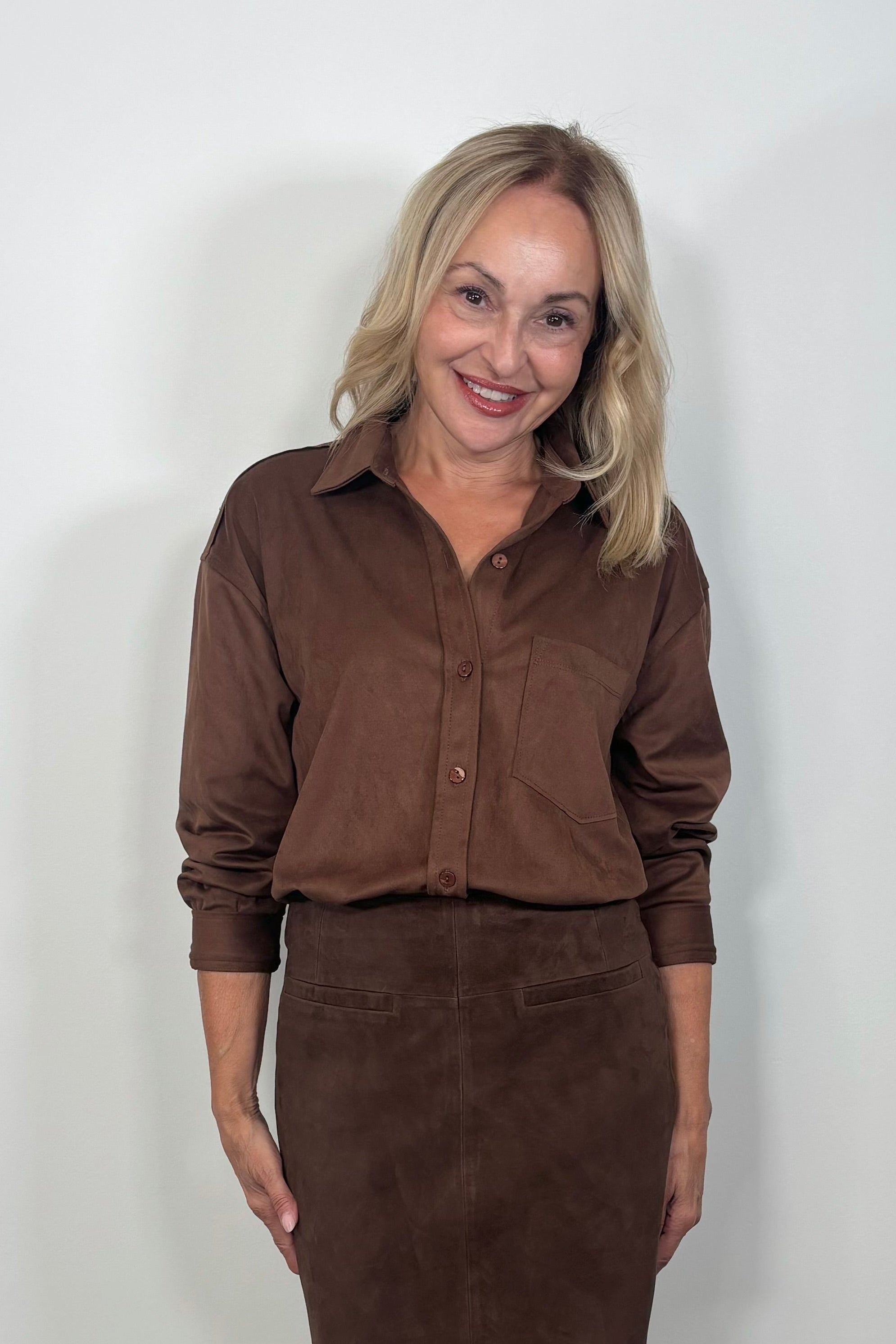 woman wearing a long sleeve faux suede shirt