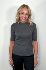  Front View of woman wearing a dark gray ribbed tee with crystal embellishments 