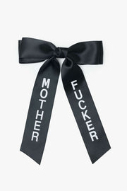 Black satin bow with mother fucker on a white background