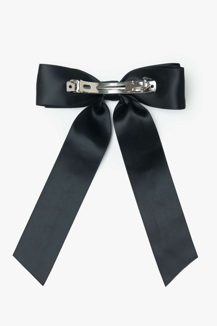 Black bow hair clip on a white background