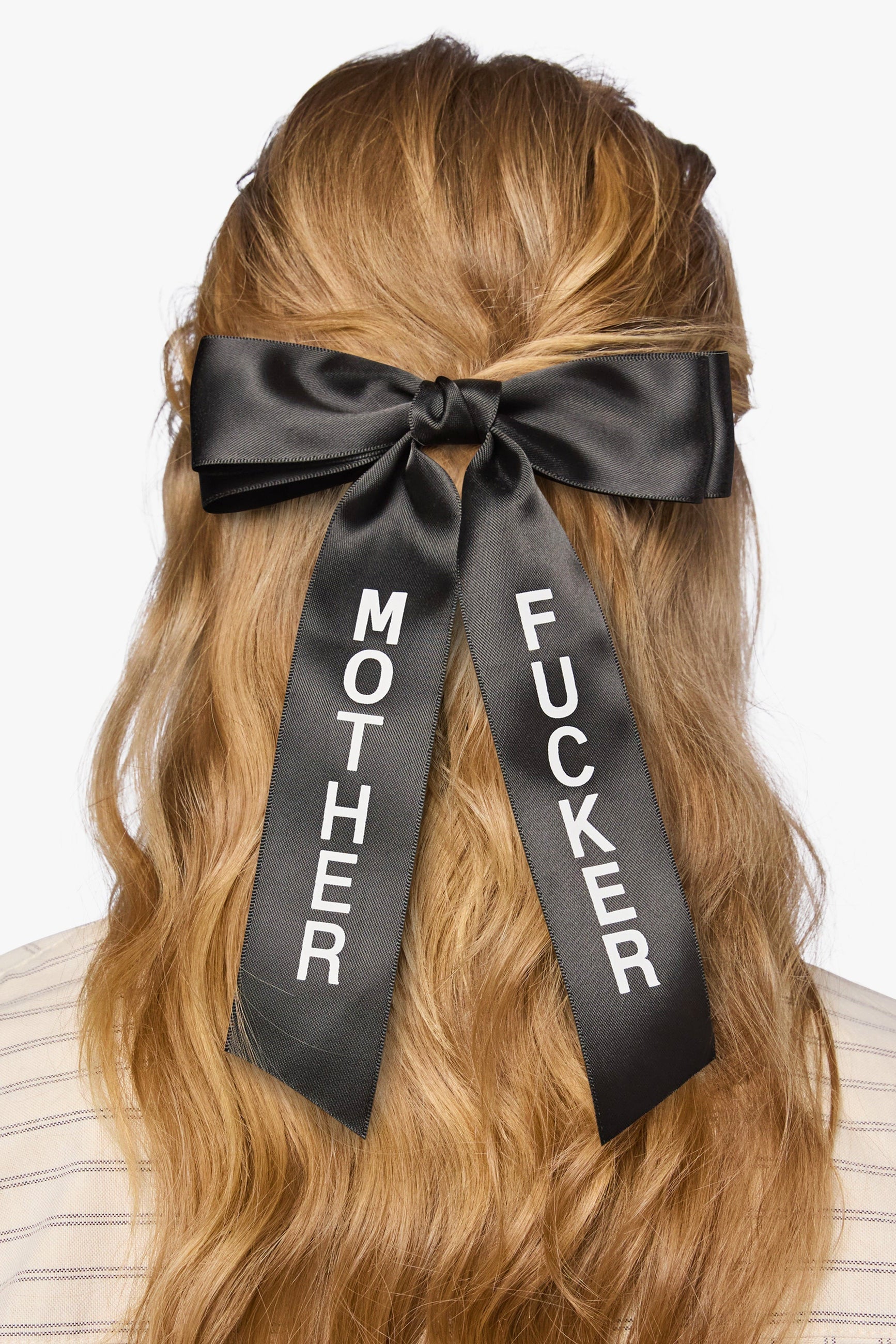 Black satin bow with mother fucker on a white background
