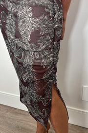 Close-up of the slit of a long sleeve mock neck mesh dress