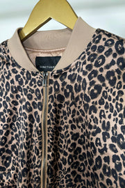 Close up of the collar of a zipped up leopard print bomber jacket