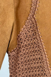 Close-up of a mixed crochet and suede leather short sleeve top
