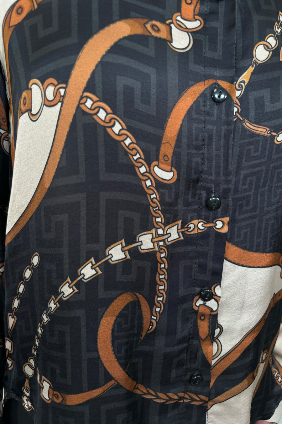 Close up view of printed button up shirt buttons 