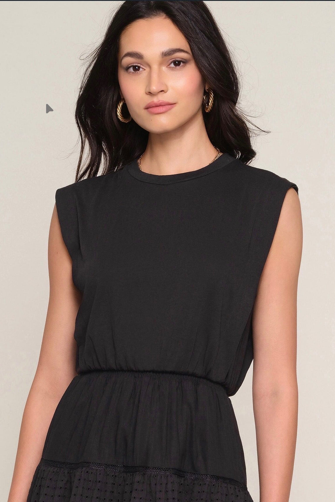 Close up of Woman wearing a black eyelet dress