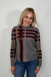 Woman wearing a gray plaid silk and cashmere blend long sleeve sweater 