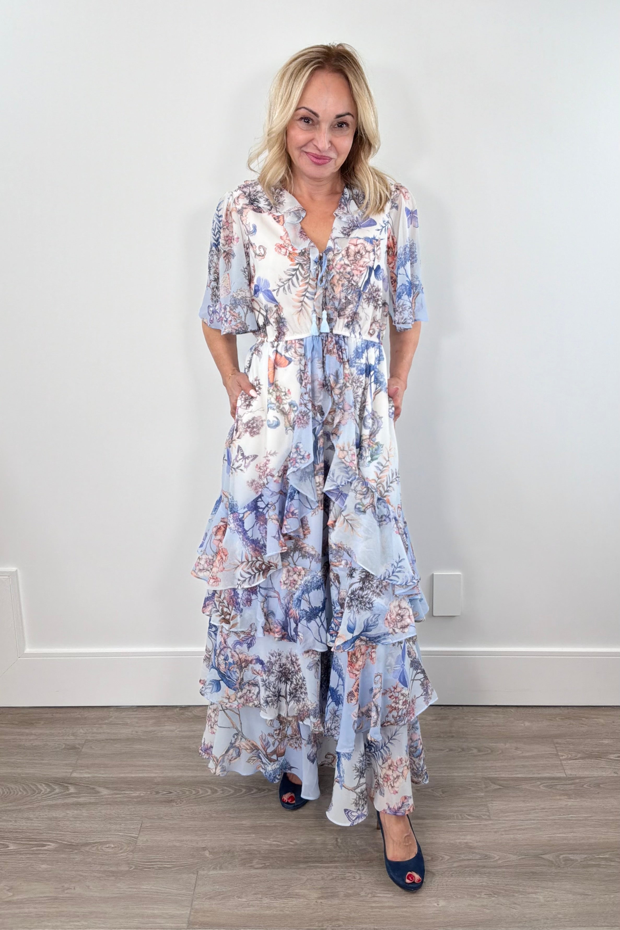 Woman wearing a blue nature printed dress