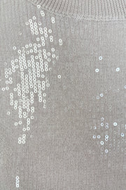 close-up of a beige sequin short sleeve top