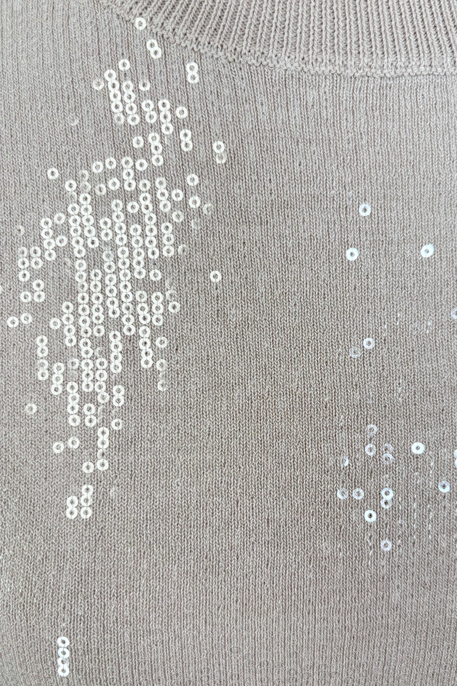 close-up of a beige sequin short sleeve top
