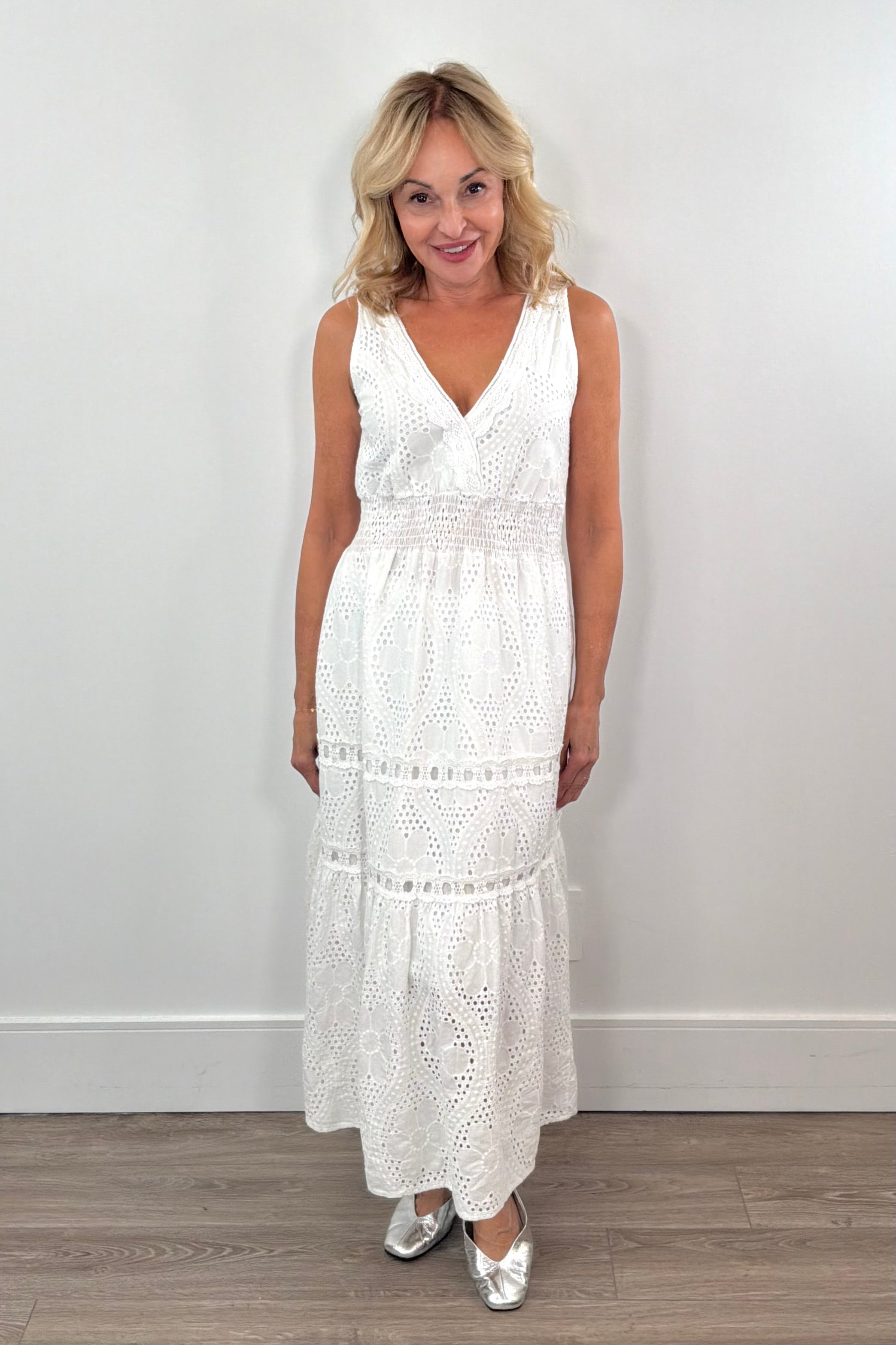 Woman wearing knit white dress