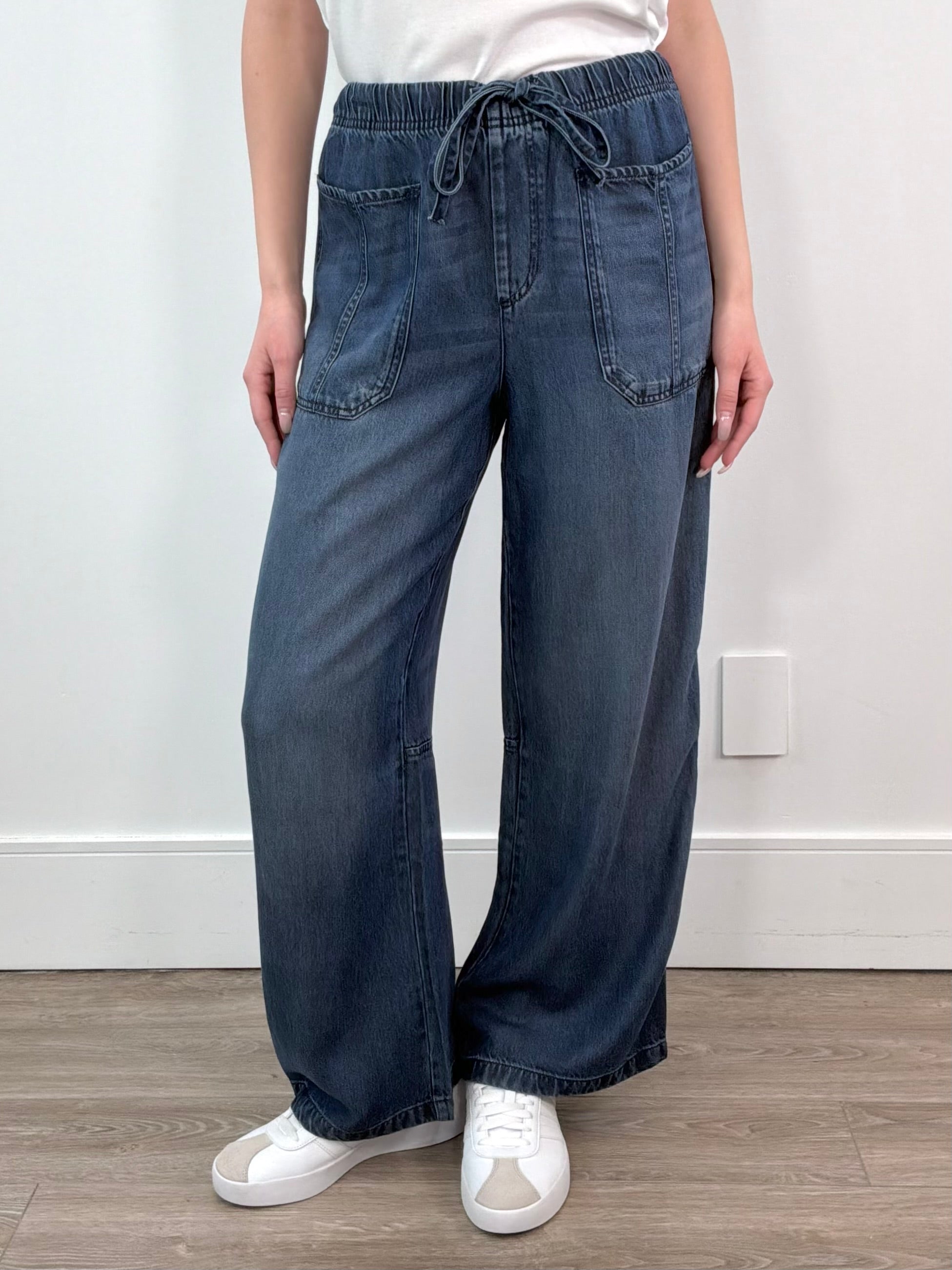 woman wearing an ankle length blue tencel denim wide leg pants