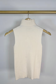 Front view of a cream knitted turtleneck tank top