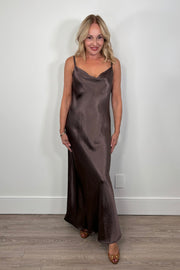 woman wearing a brown slip on satin maxi dress