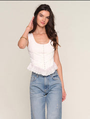 Woman wearing a white corset top