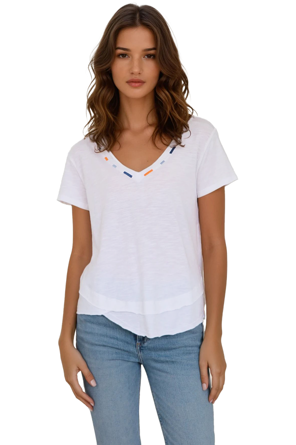 close up of woman wearing white v neck tee shirt with details on neckline