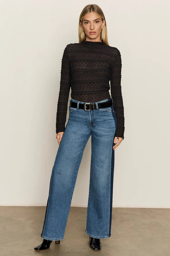 woman wearing a relaxed straight leg jeans with a stripe on the sides